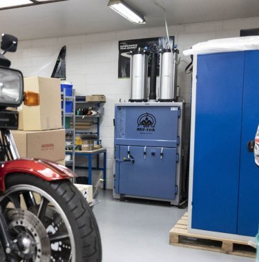 Large baler in a tiny workshop