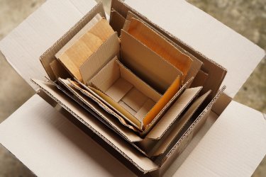 Top view of seven cardboard boxes neatly stacked inside one another