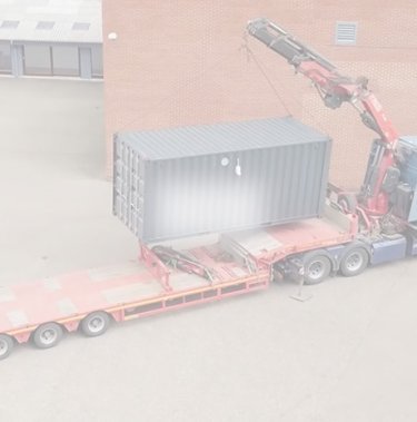 truck lifting a large container